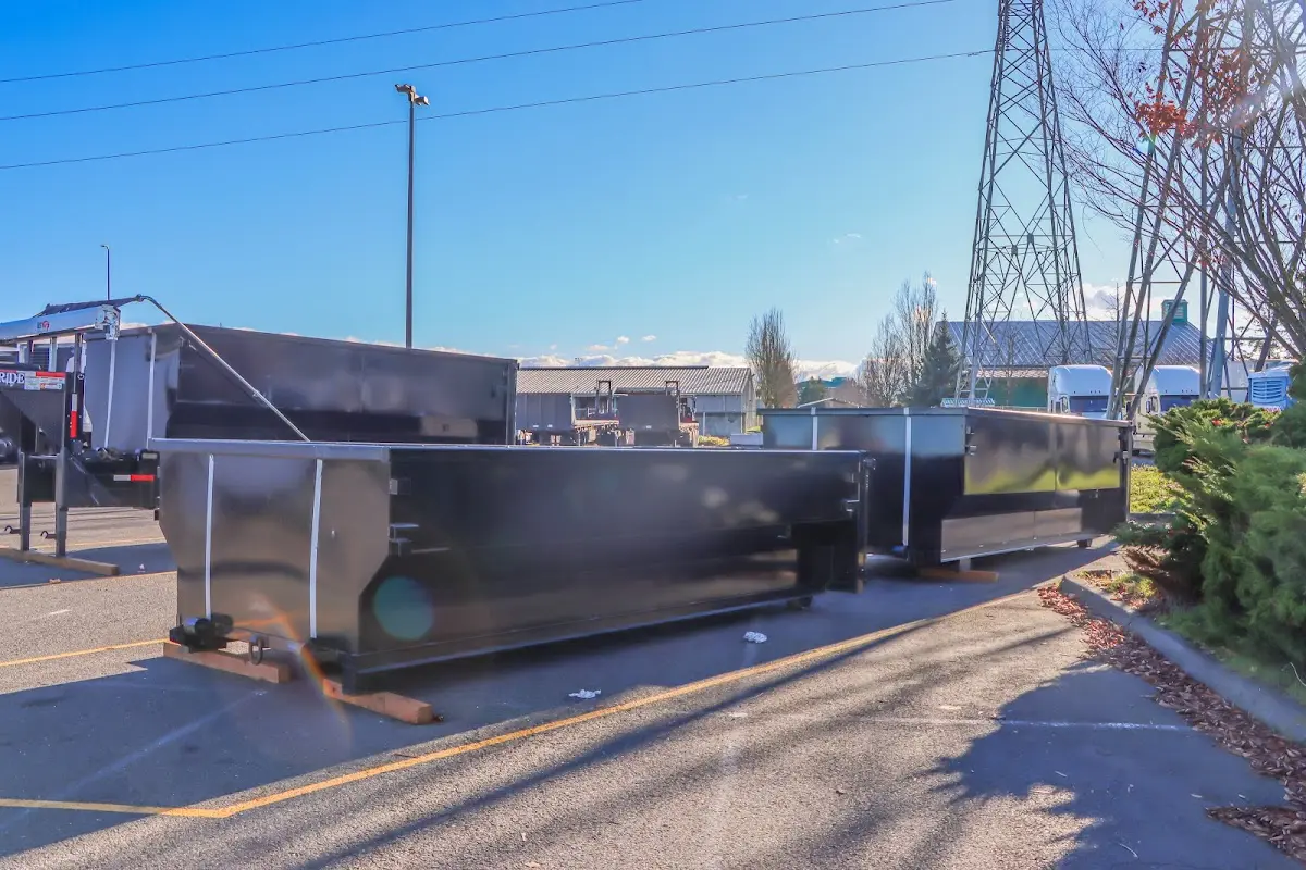 Roll-off dumpster ready for waste disposal at job site for 15 Yard Dumpster Rental in Berea